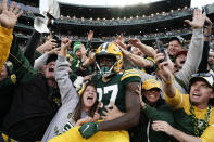 Green Bay Packers wide receiver Romeo Doubs (87) celebrates with fans after catching a 13-yard touchdown pass during the second half of an NFL football game against the New England Patriots, Sunday, Oct. 2, 2022, in Green Bay, Wis. (AP Photo/Morry Gash)