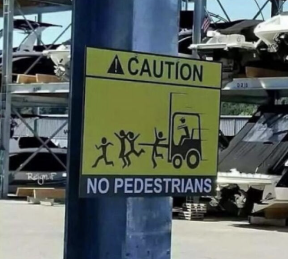 sign of a loading truck reading no pedestrians