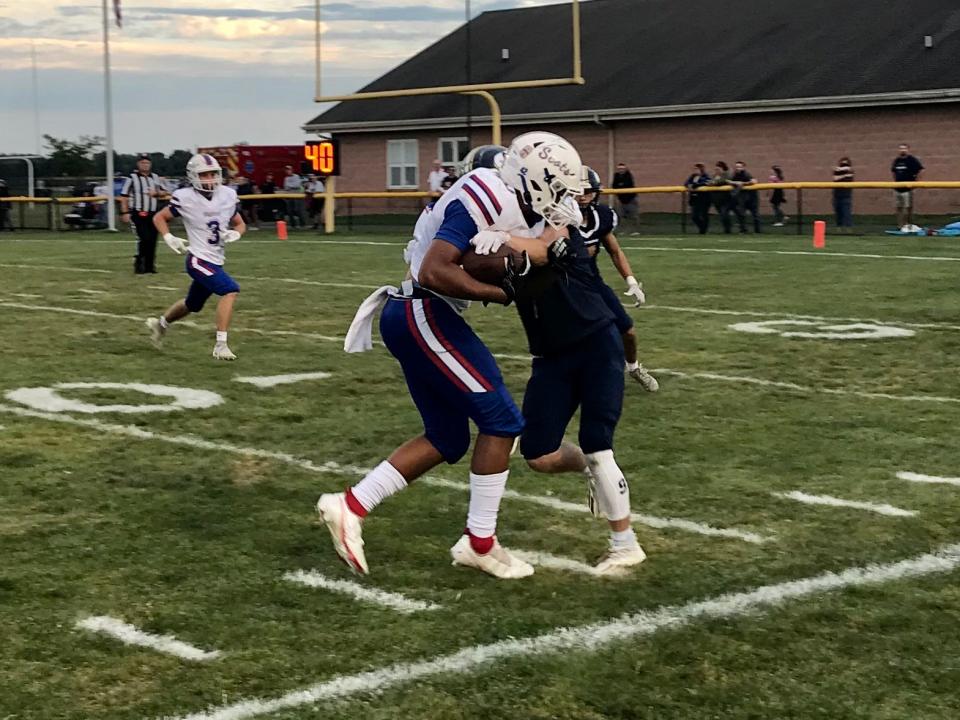 Highland's Dane Naumna, shown playing at River Valley last season, opened the 2022 season with 300 yards rushing for the Scots.