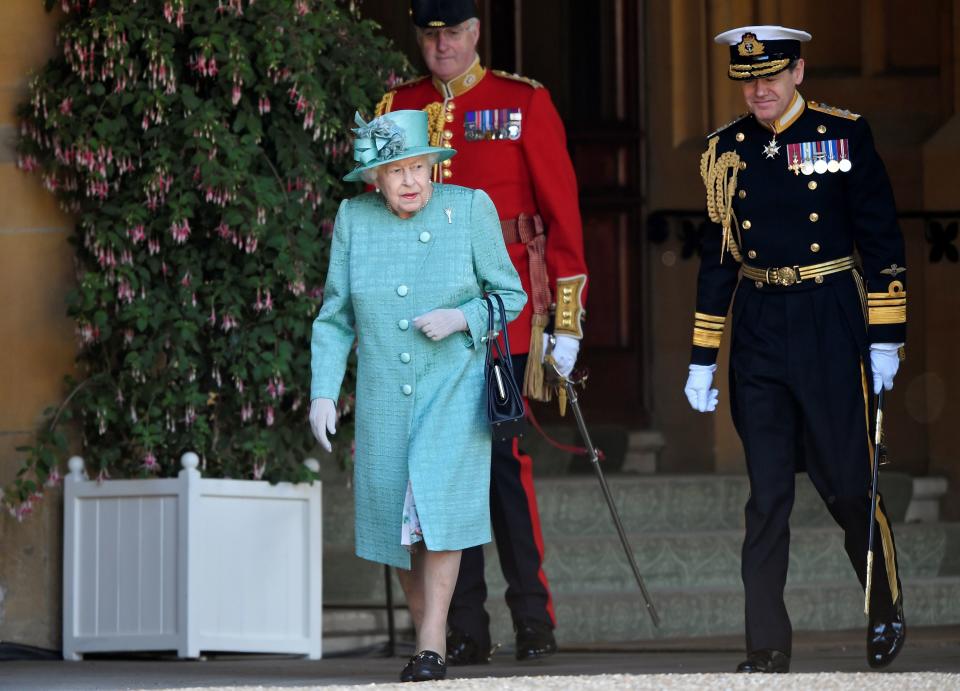 Britain's Queen Elizabeth II attends a ceremony to mark her official birthday at Windsor Castle in Windsor, southeast England on June 13, 2020, as Britain's Queen Elizabeth II celebrates her 94th birthday this year. (Photo by TOBY MELVILLE / POOL / AFP) (Photo by TOBY MELVILLE/POOL/AFP via Getty Images)