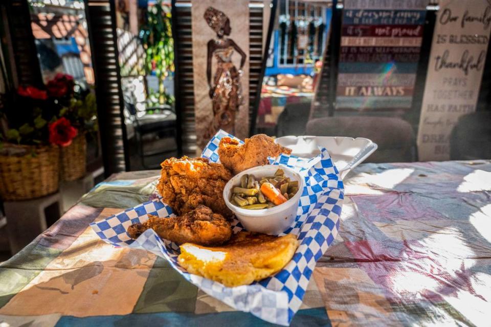 A fried chicken combo at Tori’s Place sits ready to eat. It includes three pieces of chicken, corn bread and green beans.