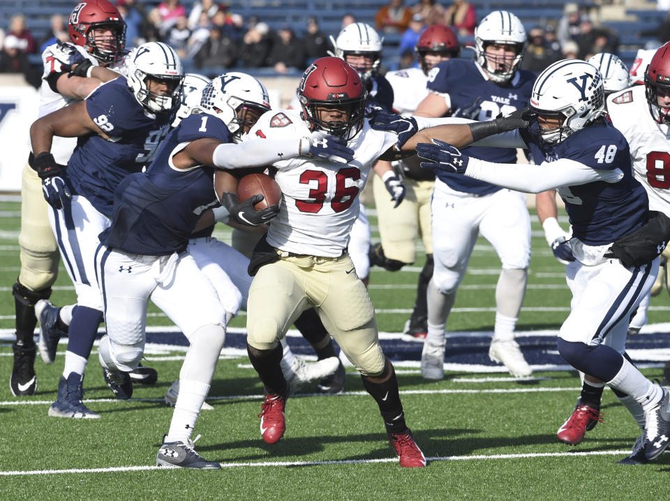 Harvard's Devin Darrington runs against Yale during the first half during an NCAA college football game, Saturday, Nov. 23, 2019, in New Haven, Conn. (Arnold Gold/New Haven Register via AP)