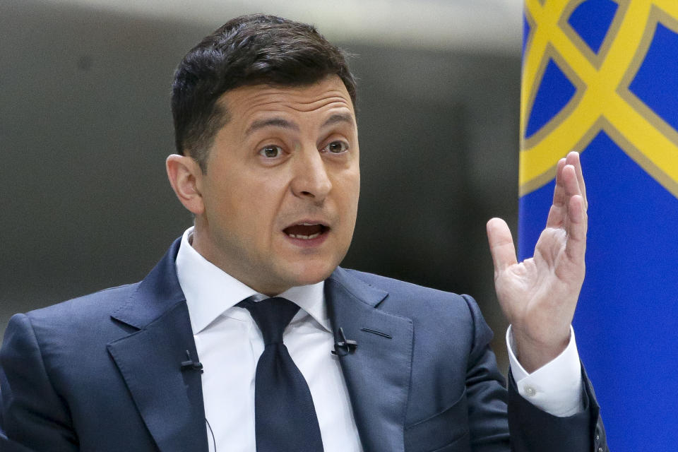 Ukrainian President Volodymyr Zelenskyy gestures while speaking to the media during a news conference at the Antonov aircraft factory in Kyiv, Ukraine, Thursday, May 20, 2021. (AP Photo/Efrem Lukatsky)