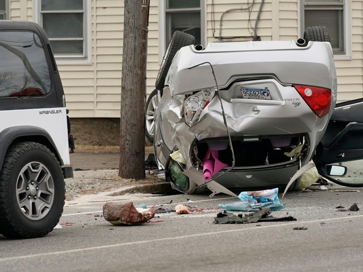 car flipped over and took out a utility pole on Main Street in South Portland after being stolen by a man who attempted to rob Town & Country Credit Union in South Portland on Thursday, March 12, 2020.