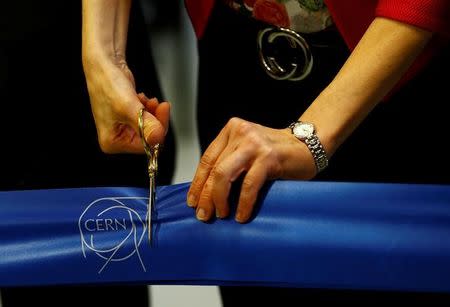 Fabiola Gianotti, CERN's Director general, cuts the ribbon during the inauguration of the new linear accelerator Linac 4 at the European Organization for Nuclear Research (CERN) in Meyrin near Geneva, Switzerland, May 9, 2017. REUTERS/Denis Balibouse