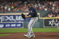 Atlanta Braves relief pitcher A.J. Minter celebrates the end of the third inning of Game 1 in baseball's World Series between the Houston Astros and the Atlanta Braves Tuesday, Oct. 26, 2021, in Houston. (AP Photo/Ashley Landis)
