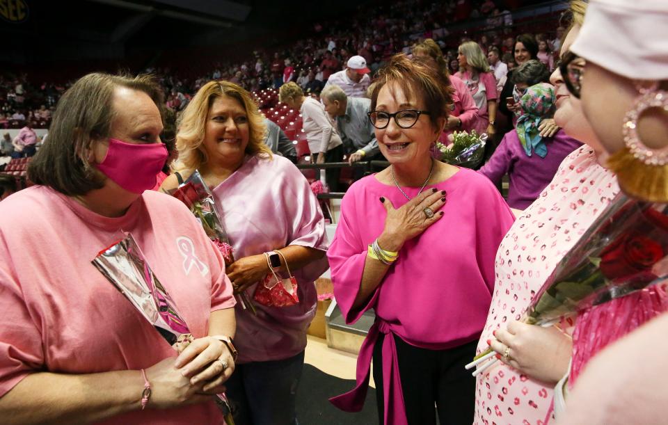 Sarah Patterson greets breast cancer survivors during a Power of Pink gymnastics meet in 2022. Patterson founded the Power of Pink meets that have spread across college and professional sports as a means of raising awareness and funds for breast cancer research. She and husband David have been selected by the United Way as the Alexis de Tocqueville Family of the Year for 2023. File Photo by Gary Cosby Jr.-Tuscaloosa News