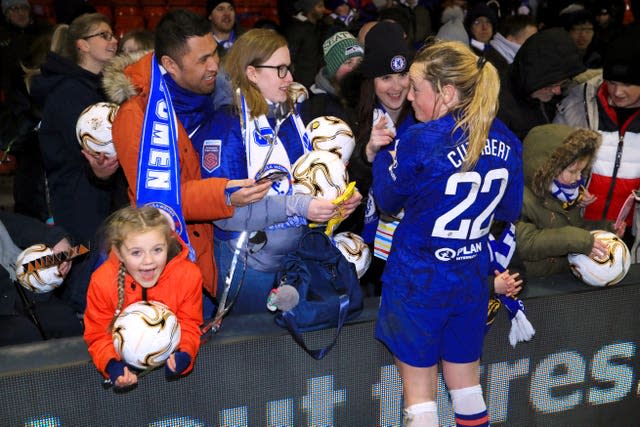 Chelsea’s Erin Cuthbert signs autographs after the final whistle