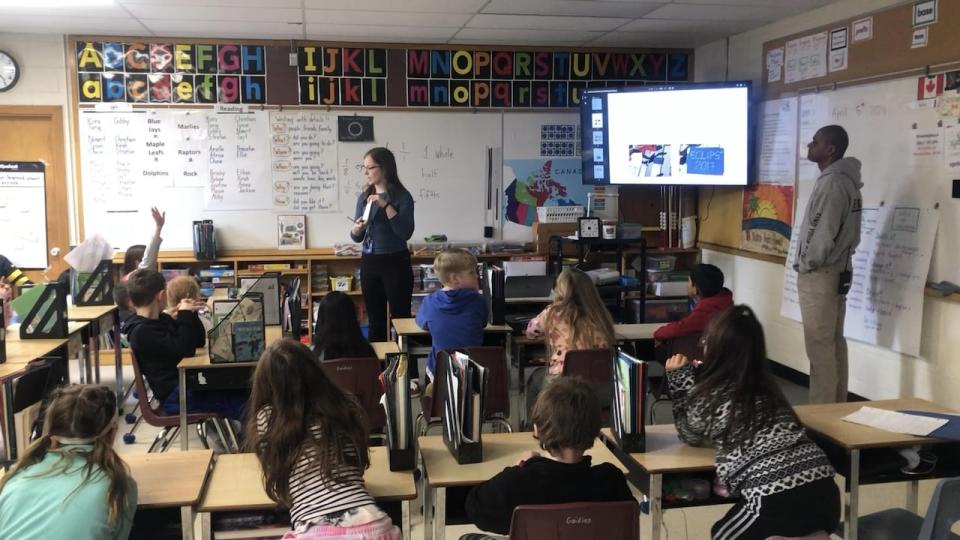 Students at Ross R. MacKay Public School in Erin learning about a solar eclipse. 