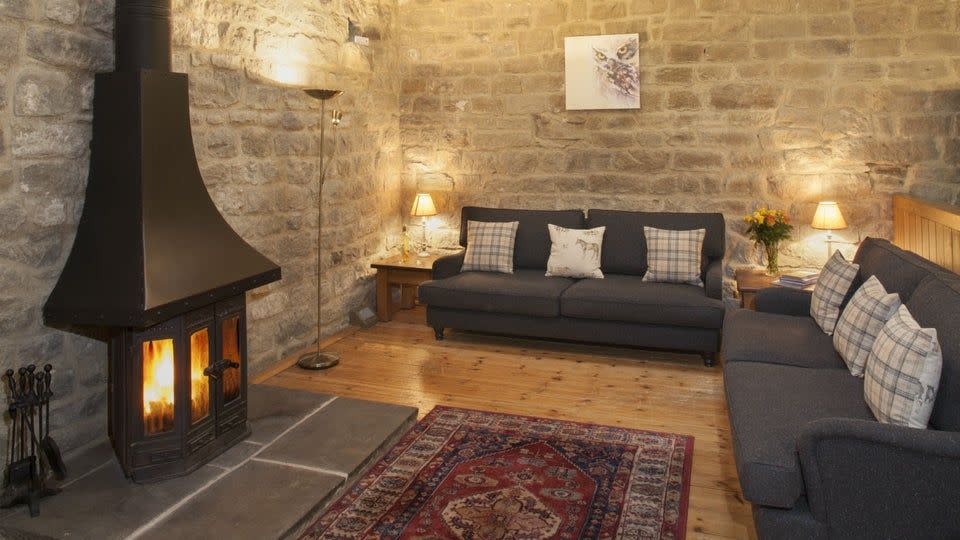 <p>A few years ago this Grade II listed barn was nothing but a romantic ruin. Now, after careful restoration, it’s been converted into a charming two-bedroom Christmas cottage. Inside, you’ll find intriguing original features from its agricultural past. Timber cow stalls form the kitchen area and original high stone walls are met by the timber frame ceiling. </p><p><strong>Be sure to...</strong> Make use of the cosy sitting room complete with wooden floors and a log burner.</p><p><strong>Sleeps:</strong> 5 </p><p><strong>Pets: </strong>Yes</p><p><strong>Price: </strong>£1,099 for 7 nights over Christmas and New Year (short breaks can be booked one month before for peak periods)</p><p><a class="link " href="https://go.redirectingat.com?id=127X1599956&url=https%3A%2F%2Fwww.nationaltrust.org.uk%2Fholidays%2Fwiddop-gate-barn-yorkshire&sref=https%3A%2F%2Fwww.redonline.co.uk%2Ftravel%2Finspiration%2Fg33891719%2Fchristmas-cottage%2F" rel="nofollow noopener" target="_blank" data-ylk="slk:FIND OUT MORE;elm:context_link;itc:0;sec:content-canvas">FIND OUT MORE</a></p>