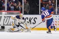 Mar 30, 2019; Uniondale, NY, USA; Buffalo Sabres goaltender Carter Hutton (40) makes a save on New York Islanders left wing Anthony Beauvillier (18) on a penalty shot during the first period at Nassau Veterans Memorial Coliseum. Mandatory Credit: Dennis Schneidler-USA TODAY Sports