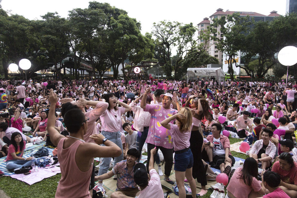 SINGAPORE, SINGAPORE - JUNE 29: Attendees dance during the Pink Dot event held at the Speaker's Corner in Hong Lim Park on June 29, 2019 in Singapore. (Photo by Ore Huiying/Getty Images)