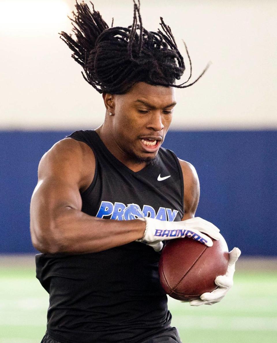 Former Boise State safety Tyreque Jones finishes a drill catching a football at Pro Day, where NFL scouts measured, weighed and drilled Broncos hoping for a shot at professional football, Monday, March 27, 2023.