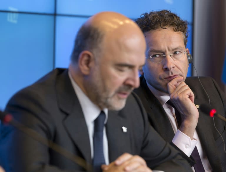 EU Economic and Financial Affairs, Taxation and Customs Commissioner Pierre Moscovici (L) and Dutch Minister of Finance, President of the Council Jeroen Dijsselbloem hold a press conference on September 12, 2015, at the European Council in Luxembourg