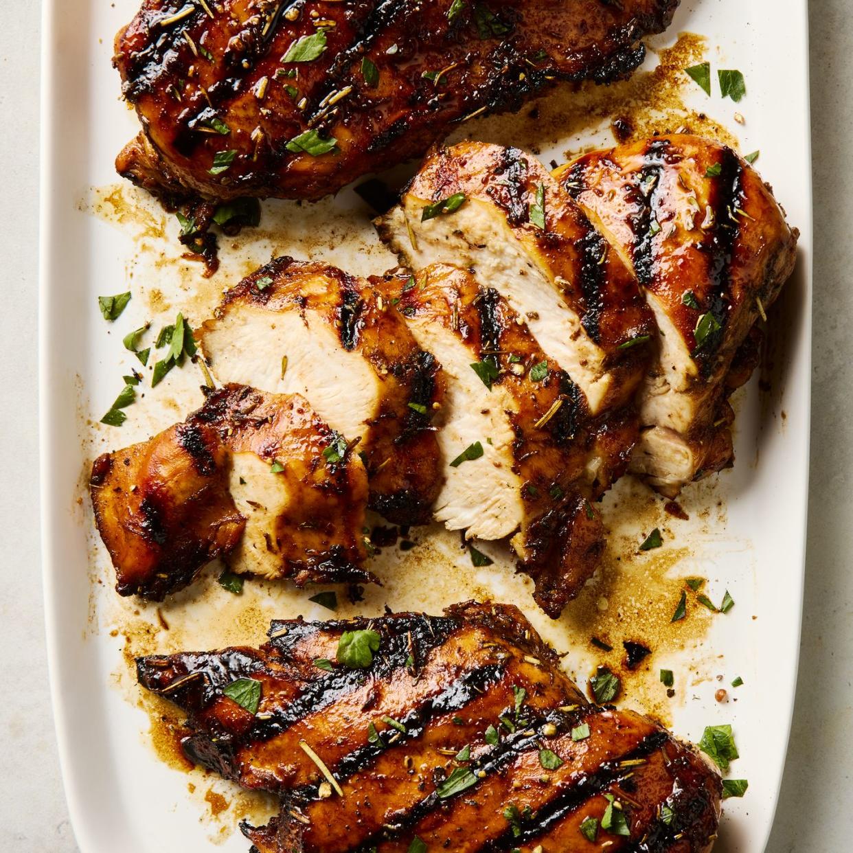 grilled chicken breasts topped with herbs