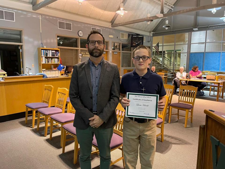 West Branch Middle School Principal Jayson Yeagley with seventh-grader Lucas Herold, the district's honored student for December.