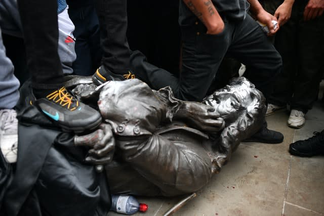 Protesters pull down a statue of Edward Colston during a Black Lives Matter protest rally in College Green, Bristol
