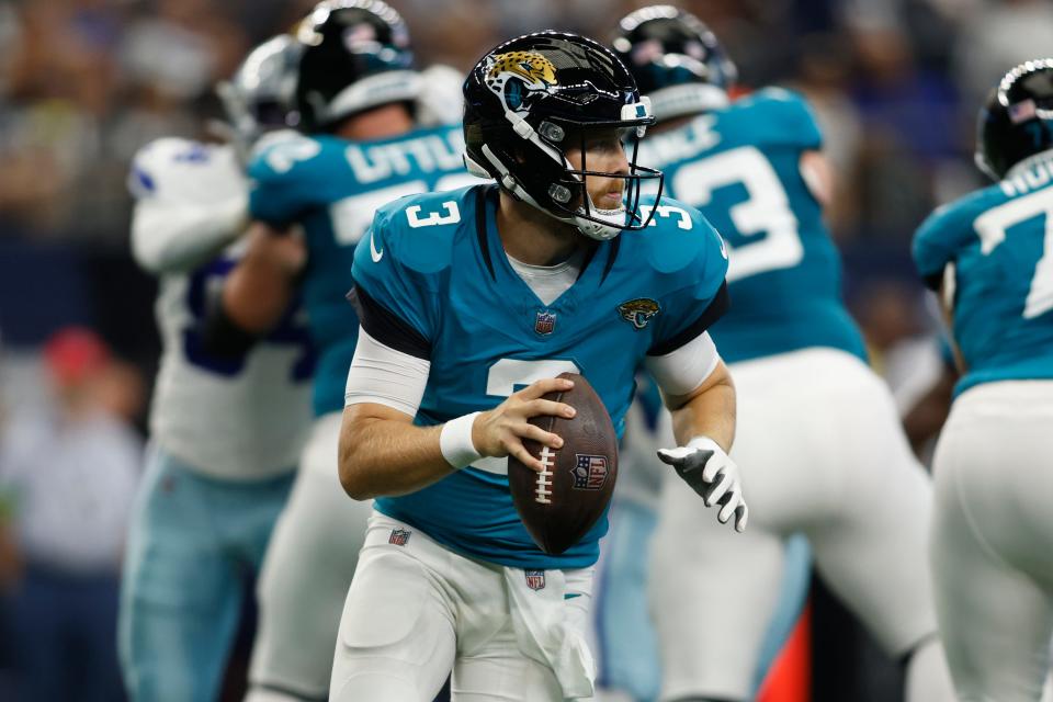 Jaguars second-team quarterback C.J. Beathard looks for an open receiver during a preasason game at Dallas on Aug. 12.