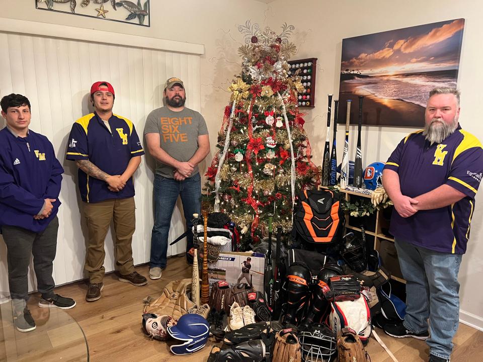 After getting equipment donations for the Vine Middle School baseball program, the guys in charge of the drive − from left, Isaiah Stafford, Joe Stafford, Brent Belue and Justin Lowe − took time to admire the gifts.