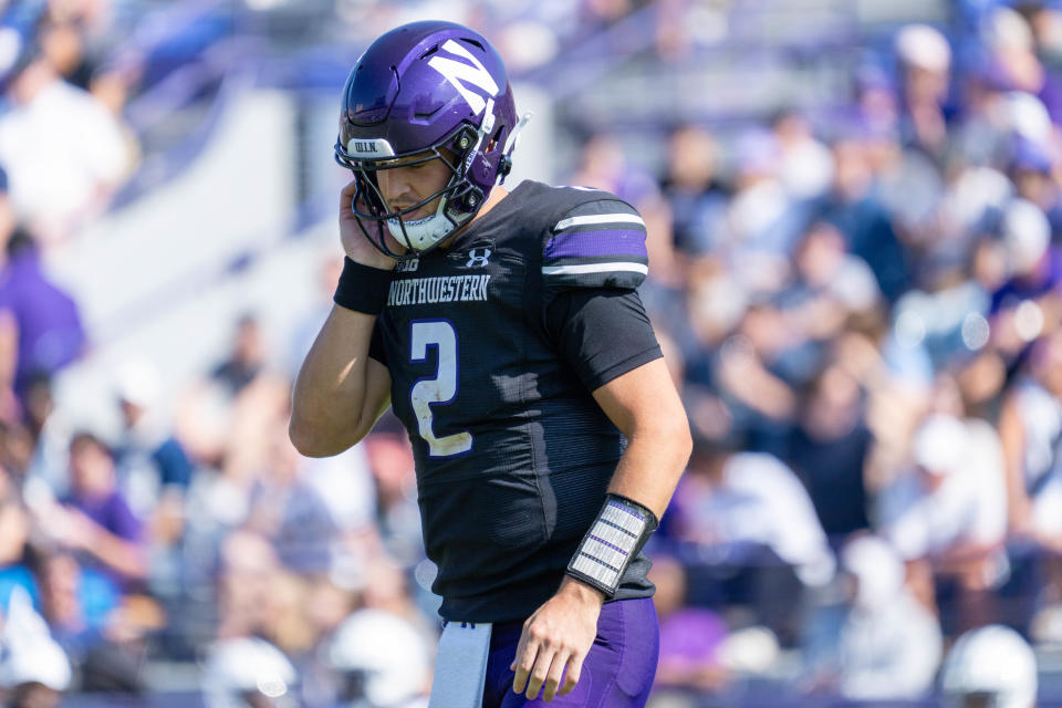 EVANSTON, IL - SEPTEMBER 30: Northwestern Wildcats quarterback Ben Bryant (2) looks down while walking off the field and adjusting his helmet during the college football game between the Penn State Nittany Lions and the Northwestern Wildcats on September 30, 2023 at Ryan Field in Evanston, IL. (Photo by Ben Hsu/Icon Sportswire via Getty Images)