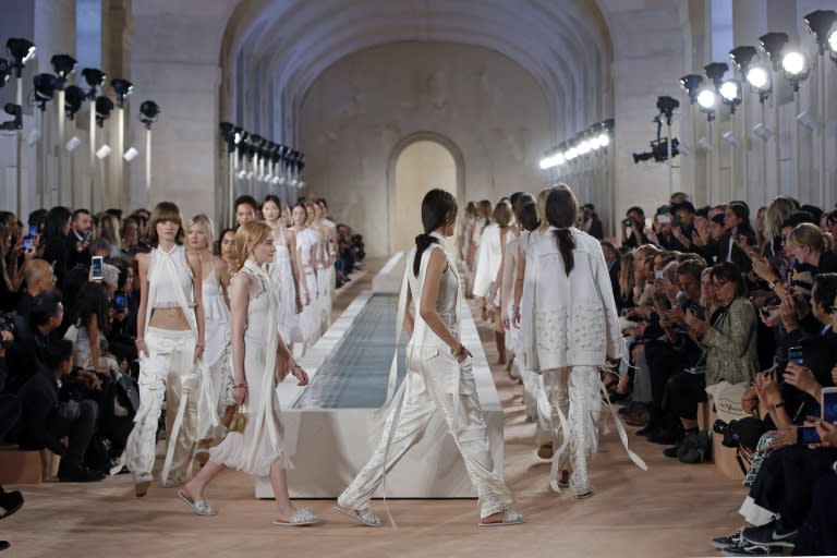 Models present creations by Balenciaga during the 2016 Spring/Summer ready-to-wear collection fashion show, on October 2, 2015 in Paris