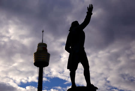 Sydney Tower can be seen behind a statue of British explorer Captain James Cook, which includes the inscription 'Discovered this Territory 1770', as it stands in Hyde Park located in central Sydney, Australia, August 24, 2017. REUTERS/David Gray