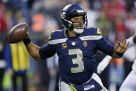 Seattle Seahawks quarterback Russell Wilson looks to pass against the San Francisco 49ers during the second half of an NFL football game, Sunday, Dec. 5, 2021, in Seattle. (AP Photo/Elaine Thompson)