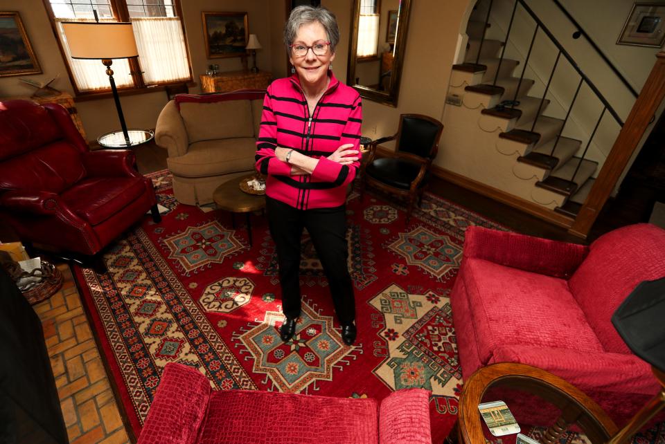 Anne Curley poses for a portrait Wednesday, March 16, 2022, at her home located in Enderis Park. “It was built in the 30’s, they just don’t make homes like this anymore,” she said. “It’s my dream home; when I come downstairs every morning I feel so happy. I am surrounded by beauty.”