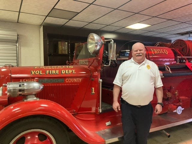 Franklin Township Fire Chief Steve Bailey with one of his departments fire engines.