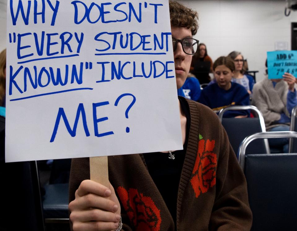 Martin Luther King Jr. Magnet High School senior Trey Madison holds a sign in protest during the Metro Nashville Public Schools Board of Education meeting in Nashville, Tenn., on Tuesday, Feb. 27, 2024.