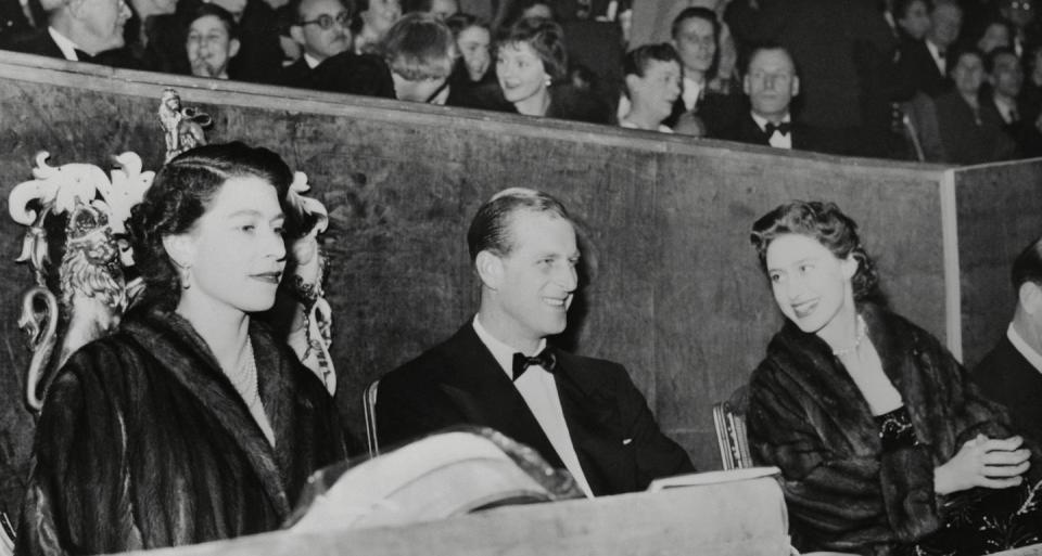 <p>After she took her seat at the circus, Queen Elizabeth enjoyed the show with her husband, Prince Philip, and her sister, Princess Margaret (far right). </p>