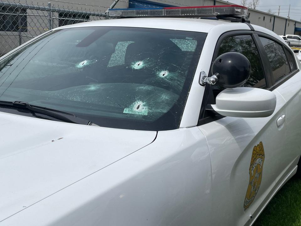 A Indianapolis police vehicle was damaged during a shooting April 20, 2023. The gun used by the suspect sent bullets flying into one of the patrol vehicles at the scene, damaging its hood, grill, side, and both its front and back windshields.