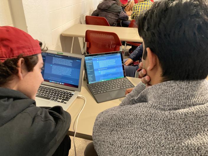 Iowa State University students Humza Maqsood, a freshman at right, and Jonah Vancil, a sophomore at left, work with ChatGPT in an English class on Friday, Jan. 27, 2023. The university is among schools and colleges across the country grappling with how to help students and faculty realize benefits of the recently launched artificial intelligence system and others like it while preventing academic dishonesty.