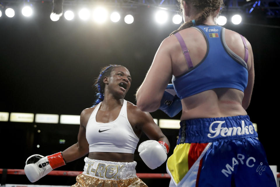 Claressa Shields, left, swings at Belgium's Femke Hermans, during their WBC/IBF/WBA middleweight title boxing match, Saturday, Dec. 8, 2018, in Carson, Calif. (AP Photo/Chris Carlson)