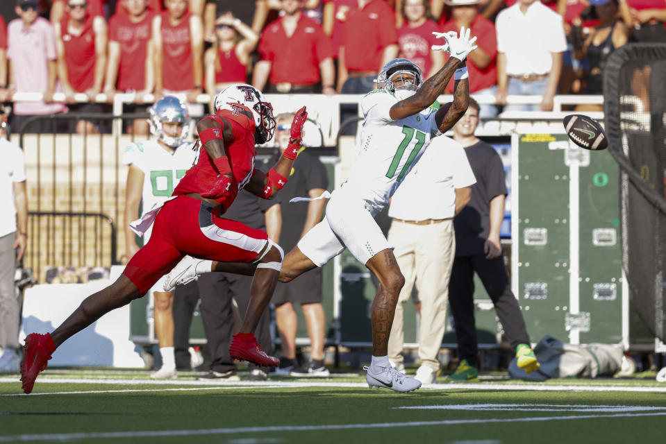 Oregon wide receiver Troy Franklin (11) attempts to catch a pass against Texas Tech during the first half of an NCAA college football game, Saturday, Sept. 9, 2023, in Lubbock, Texas. (AP Photo/Chase Seabolt)
