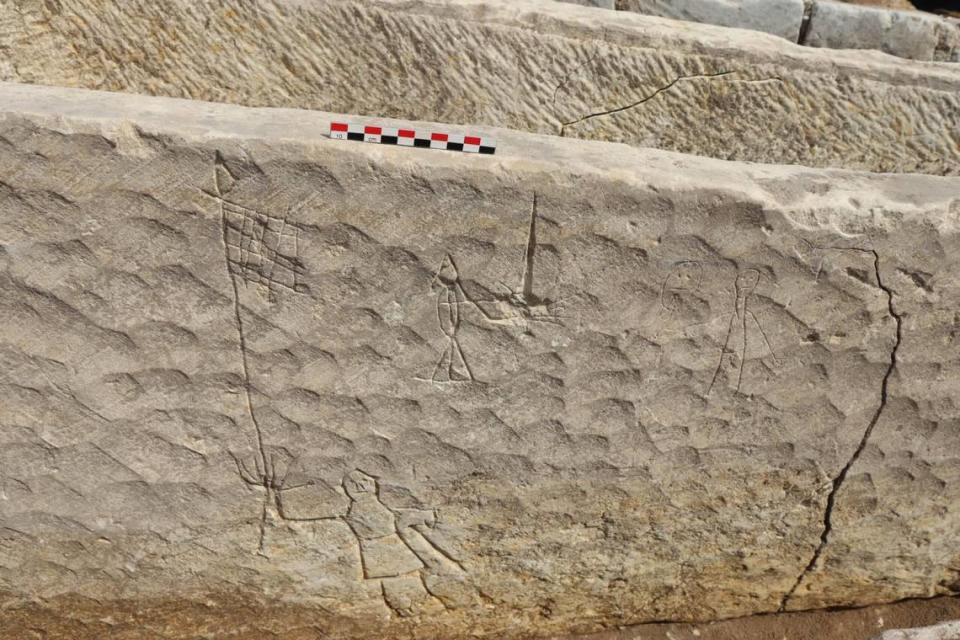 Graffiti on a sarchophagus found at the site. Photo by Philippe Blanchard from INRAP