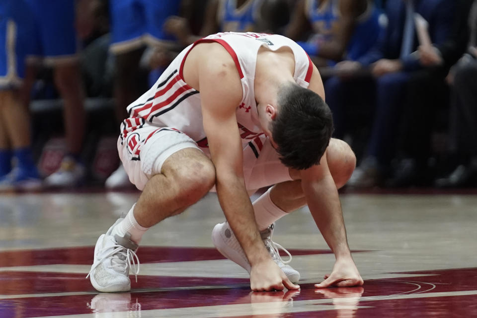 Utah guard Lazar Stefanovic reacts after missing a shot during the second half of the team's NCAA college basketball game against UCLA on Thursday, Jan. 20, 2022, in Salt Lake City. (AP Photo/Rick Bowmer)