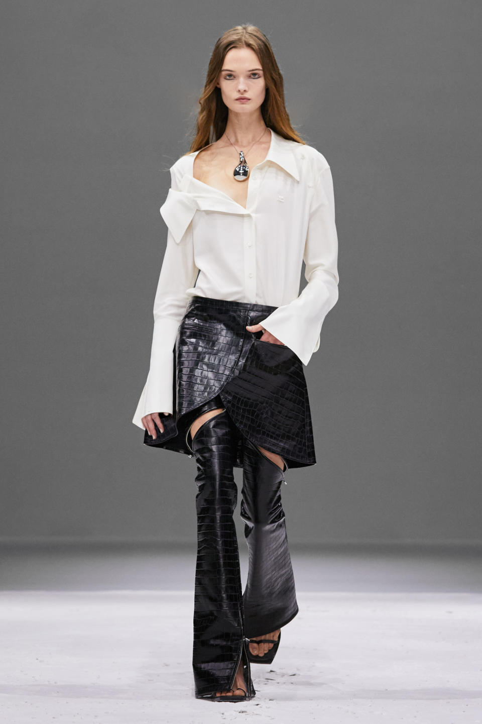 Courreges RTW Spring 2024 flared pants with skirt on top and white button down