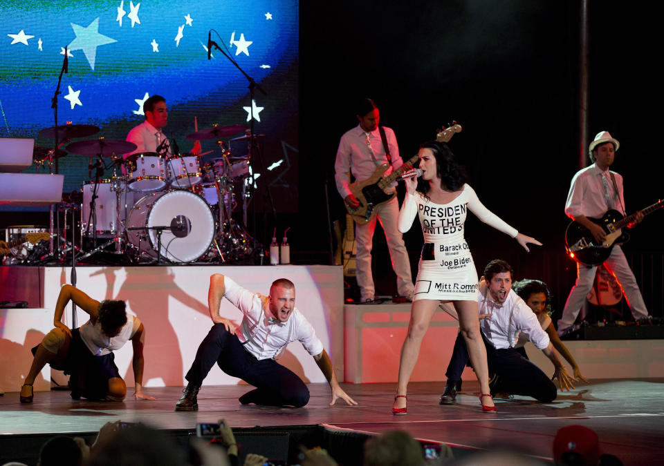 Singer Katy Perry performs for a crowd before the arrival of President Barack Obama at a campaign rally, Wednesday, Oct. 24, 2012, in Las Vegas. (AP Photo/Julie Jacobson)