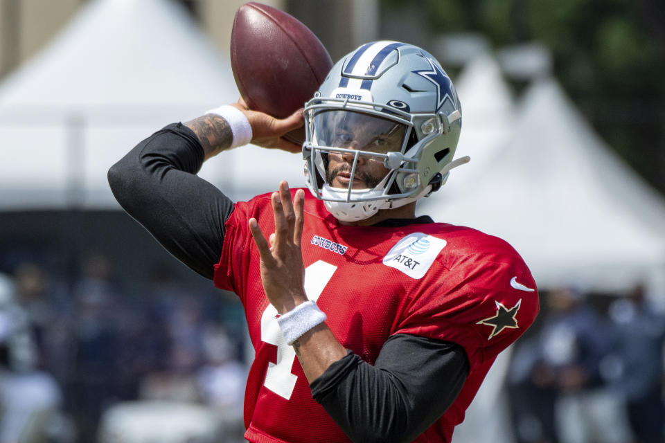 Dallas Cowboys quarterback Dak Prescott passes during drills at practice at the NFL football team's training camp in Oxnard, Calif., Wednesday, July 28, 2021. (AP Photo/Michael Owen Baker)