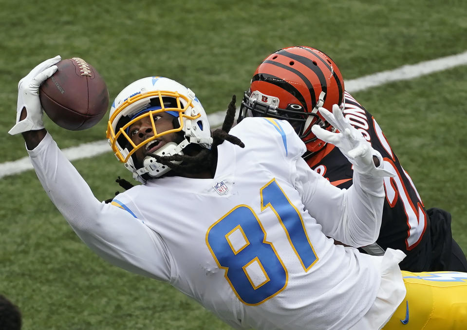 Los Angeles Chargers' Mike Williams (81) tries to make a catch against Cincinnati Bengals' William Jackson (22) during the first half of an NFL football game, Sunday, Sept. 13, 2020, in Cincinnati. The pass was incomplete. (AP Photo/Darron Cummings)