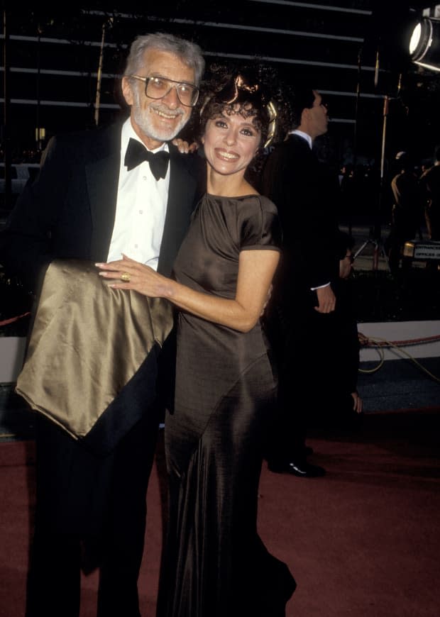 Rita Moreno and her husband Lenny Gordon during 59th Annual <a href="https://parade.com/movies/oscars-2023-academy-awards" rel="nofollow noopener" target="_blank" data-ylk="slk:Academy Awards;elm:context_link;itc:0;sec:content-canvas" class="link ">Academy Awards</a> at Shrine Auditorium in Los Angeles<p><a href="https://www.gettyimages.com/detail/105855346" rel="nofollow noopener" target="_blank" data-ylk="slk:Ron Galella/Getty Images;elm:context_link;itc:0;sec:content-canvas" class="link ">Ron Galella/Getty Images</a></p>