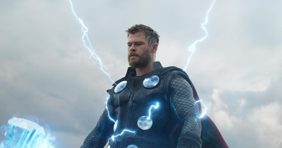 Thor holding his Stormbreaker ax, with lightning emanating from the ax and his body.