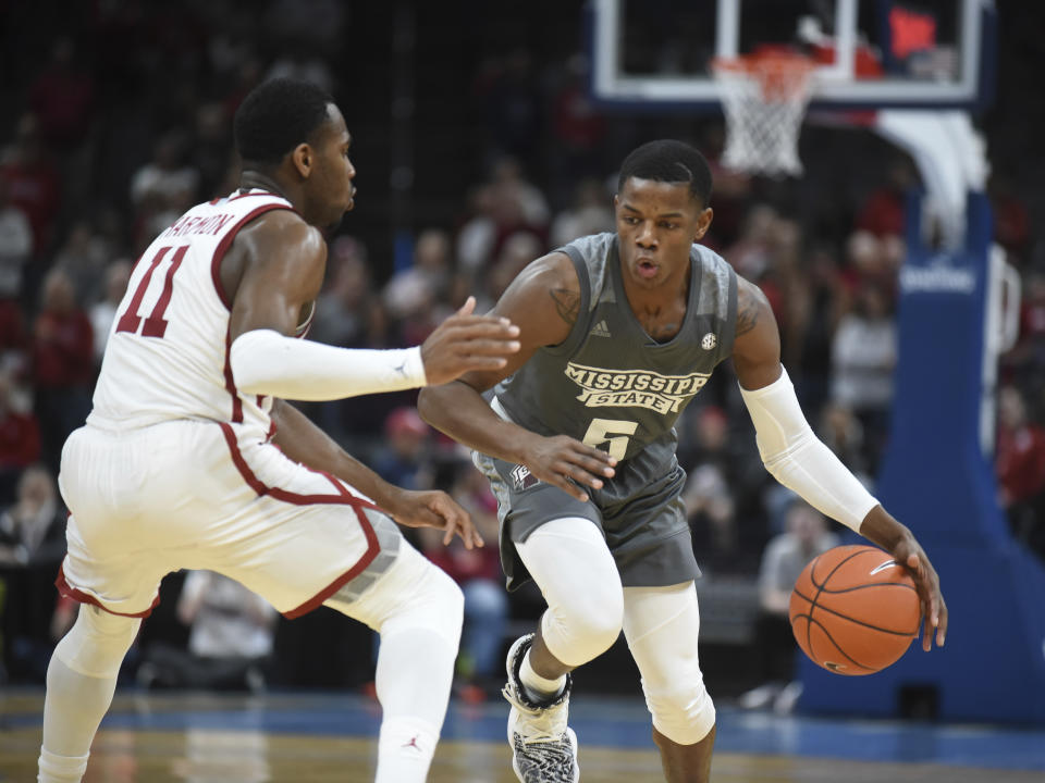 Mississippi State guard Iverson Molinar (5) looks for an opening past Oklahoma guard De'Vion Harmon (11) during the second half of an NCAA college basketball game in Oklahoma City, Saturday, Jan. 25, 2020. (AP Photo/Kyle Phillips)