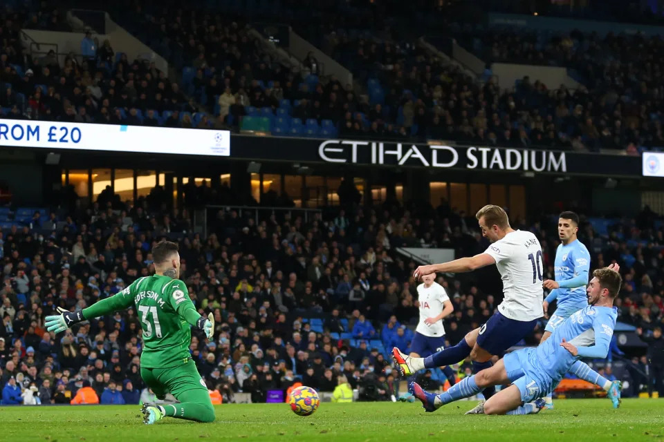 MANCHESTER, ENGLAND - FEBRUARY 19: Ederson of Manchester City saves from Harry Kane of Tottenham Hotspur during the Premier League match between Manchester City and Tottenham Hotspur at Etihad Stadium on February 19, 2022 in Manchester, United Kingdom. (Photo by Robbie Jay Barratt - AMA/Getty Images)