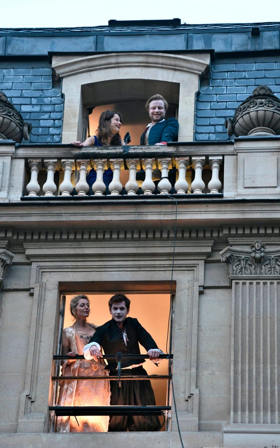 Actors perform on the balconies of the Comedie Francaise - Getty