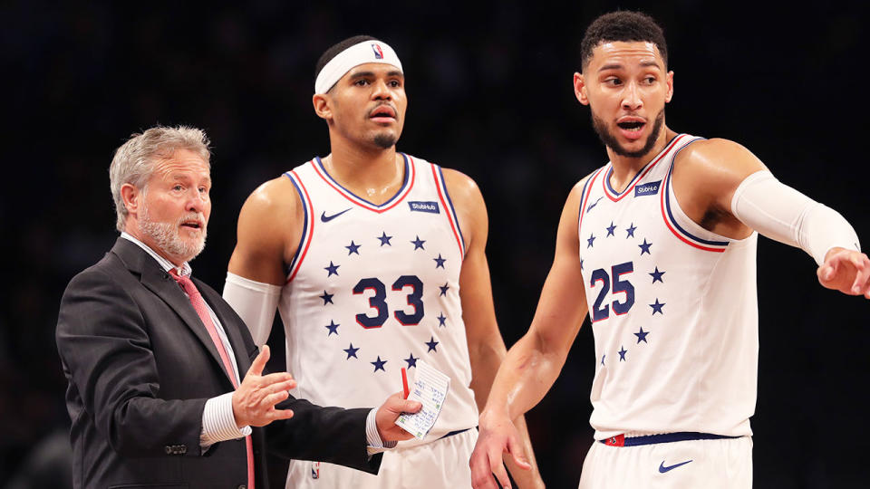 Pictured here, coach Brett Brown talks with Philadelphia players during an NBA game.