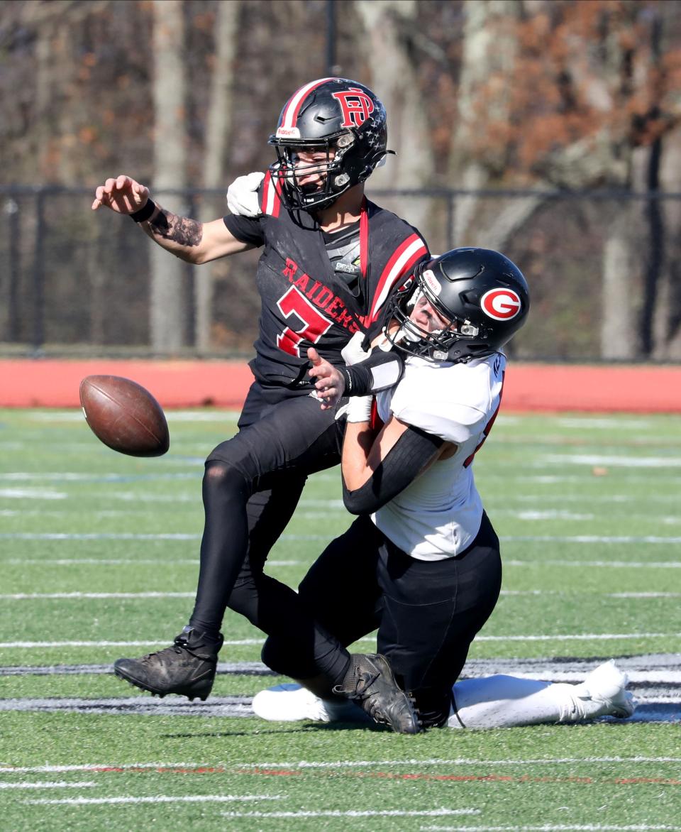 Jake Kessner from Rye strips the ball from Port Jervis quarterback Dylan Fox Game during the Rye vs. Port Jervis NYSPHSAA Class B regional final football game at Goshen High School, Nov. 18, 2023.