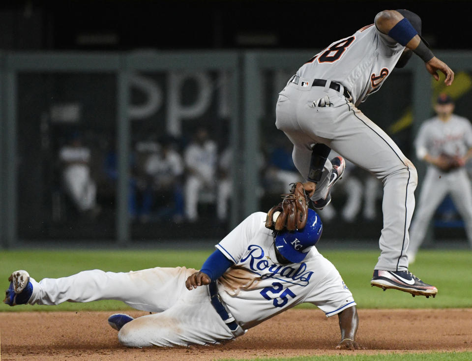 Kansas City Royals' Brian Goodwin (25) is tagged out by Detroit Tigers second base Niko Goodrum (28) as the tried to steal second during the the sixth inning of a baseball game Tuesday, July 24, 2018, in Kansas City, Mo. (AP Photo/Ed Zurga)
