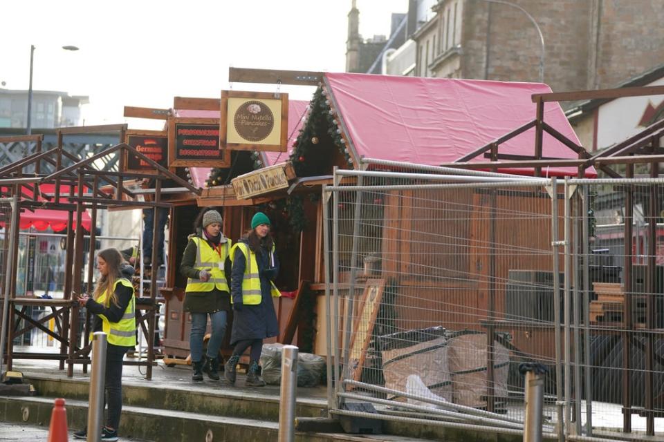 Set construction build a Christmas market in the Trongate area of Glasgo (Andrew Milligan/PA) (PA Wire)